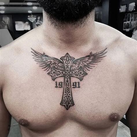 cross with wings tattoo chest